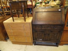 An oak bureau, Art Deco style oak chest of three drawers, oak sewing table,