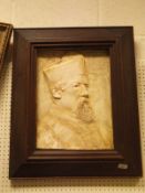 AFTER GEORGE FRAMPTON (1860-1928) "Study of bearded priest in cassock", plaster relief,