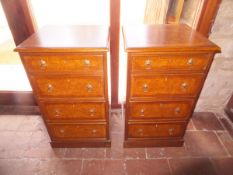 A pair of burr oak and crossbanded bedside chests of four drawers,