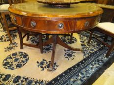 A mahogany drum library table in the Regency taste,