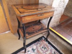 A Continental walnut and marquetry inlaid side table with lift top compartment and inlaid undertier,