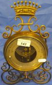 An Edwardian Fahrenheit thermometer in brass case with built in barometer, the back marked "PHBN",