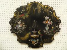 A Victorian black lacquered papier-mache mother of pearl inlaid and painted shaped panel decorated