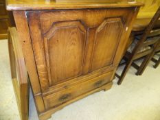 A modern oak tv cabinet in the 18th Century style, a stained beech side table,