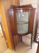 An Edwardian mahogany and inlaid and transfer decorated corner cupboard,