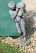 An early 20th Century lead figure of a young boy with water jug CONDITION REPORTS