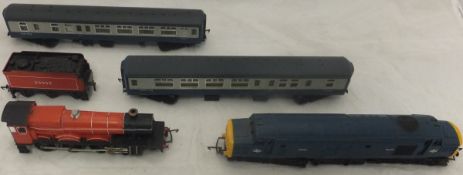 A box containing an assortment of various dublo trains and various accessories
