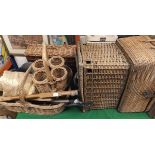 A collection of wicker baskets to include a wine carrier, etc, various suitcases,