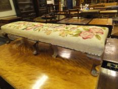 A Victorian satin walnut table, the plain top on turned legs to castors,