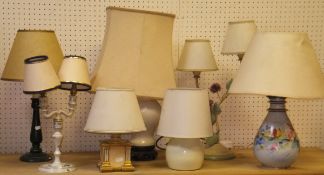 A large selection of various table lamps and shades