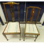A set of four early 20th Century mahogany slat back dining chairs,