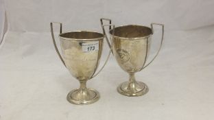 Two sterling silver twin-handled presentation cups by N G Wood & Sons, Boston,