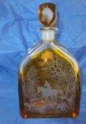 An Orrefors clear and amber glass overlaid decanter decorated with hunting scenes,