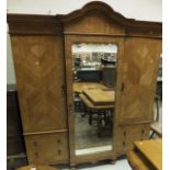 An early 20th Century Maple & Co Ld walnut veneered and inlaid breakfront wardrobe,
