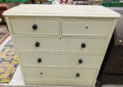 A cream painted pine chest of two short over three long drawers