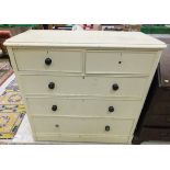 A cream painted pine chest of two short over three long drawers