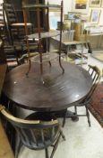 A Victorian rosewood centre table with faceted column to triform base,