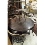 A Victorian rosewood centre table with faceted column to triform base,