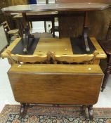 A Victorian mahogany Sutherland table raised on brass caps and casters,