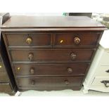 A 19th Century stained pine chest of two short over three long drawers with mother of pearl