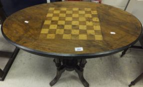 A collection of furniture comprising a mahogany chess board topped oval occasional table on four