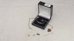 A Goldsmiths box containing a yellow metal bangle with clear stones, two pairs of pearl ear studs,