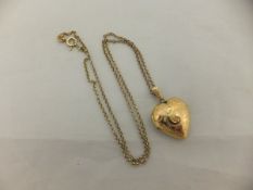 A 9 carat gold heart shaped locket on chain, approx 6.