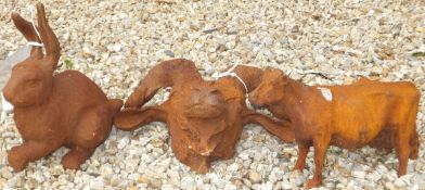 A collection of three cast iron garden ornaments, to include a hare,