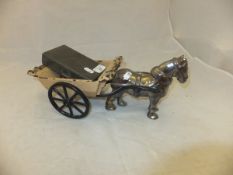 A Victorian cast iron and enamelled horse and cart figure by Ofco and a James Dixon & Son.