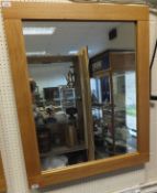 An oak framed rectangular wall mirror (to be sold with the option on 207)