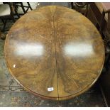 A Victorian burr walnut loo table on quadruped base