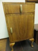 A stained pine glass fronted single door cupboard,