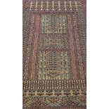 A Persian prayer rug, the central panel set with two pillars, both on a beige ground, within blue,