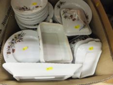 A box containing a Victorian pottery dinner service with floral transfer decoration and a box