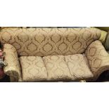 A circa 1900 upholstered drop end scroll arm sofa