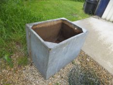 A large rectangular galvanized water butt / planter