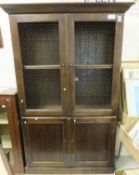 An OKA stained cherrywood two section bookcase,