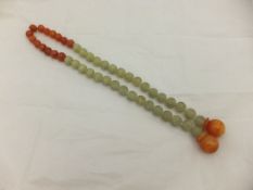 A string of Chinese jade and carnelian prayer beads