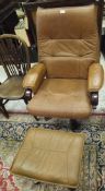 A modern tan leather covered swivel armchair,