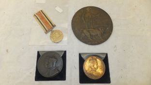 A collection of four military coins and medallions to include a Special Constable medal awarded to