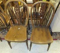 Four oak and elm wheel and stick back kitchen chairs,