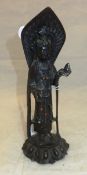 A Chinese bronze figure of Guan-Yin with coral and turquoise bead inlaid decoration