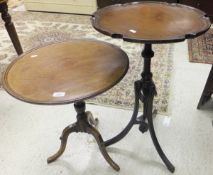 An Edwardian mahogany occasional table with pie-crust top raised on reeded and swept tripod base