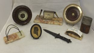 A box of miscellaneous items to include a large plated bottle coaster,