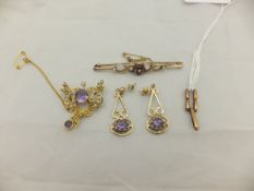 A 9ct gold bar brooch set with four pink topaz mounted in the shape of a daisy,