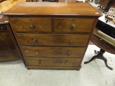 A Victorian walnut chest of two short and three long drawers