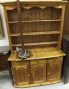 A modern pine dresser and a standard lamp CONDITION REPORTS General wear, scuffs,