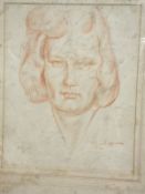 A box containing various pictures to include pencil portrait study of a young woman,