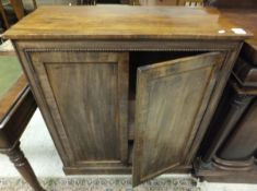 A Victorian mahogany two door side cabinet with beaded decoration,