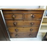 A Victorian mahogany chest of two short and three long graduated drawers